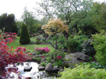 The wonderful Danish garden of Gunhild and Thorkild Poulsen. The garden contains borders for plants of woodland, rock garden, water and ordinary soil.